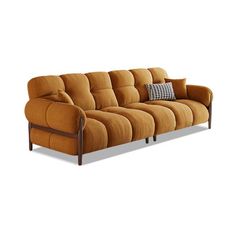 a brown couch with two pillows on it's back and the seat upholstered