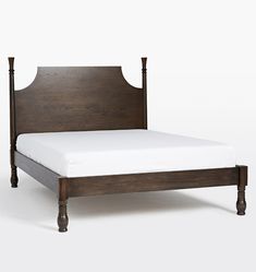 the bed frame is made from wood and has two posts on each side, along with a white mattress