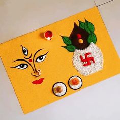 a yellow door mat with an image of a woman's face and two eggs on it