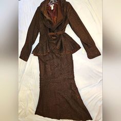 Nwt, Brown Tweed Print Suit, Jacket Is A High Low Peplum Design, With A Double Collar And A Tie At The Waist, Measures 18in Flat From Arm Pit To Arm Pit, The Skirt Is Mermaid Style, With Back Zipper, Button And Elastic In The Waist, Waist Measures 14in Flat, Hip 18in Flat Across, Skirt Is 40in From Waist To Hem. No Smoke No Pet Home. Brown Fitted Skirt Suit For Winter, Winter Brown Fitted Skirt Suit, Brown Skirt Suit For Fall, Fitted Long Sleeve Brown Skirt Suit, Fall Long Sleeve Brown Skirt Suit, Brown Long Sleeve Skirt Suit For Fall, Fall Brown Long-sleeved Skirt Suit, Fall Brown Long Sleeve Skirt Suit, Elegant Fitted Brown Skirt Suit