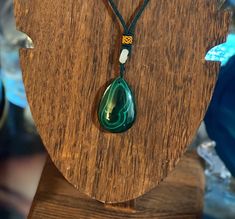 Beautiful large teardrop Malachite necklace. Polished stone with beautiful greens all through out. Malachite is a very powerful stone, great for protecting in the spiritual world, as well as manifestation energy. Green Oval Pendant Amulet Necklace, Green Pendant Crystal Amulet Necklace, Green Amulet Pendant Crystal Necklace, Green Amulet Crystal Pendant Necklace, Spiritual Healing Necklace With Teardrop Pendant, Spiritual Gemstone Teardrop Pendant Crystal Necklaces, Spiritual Teardrop Gemstone Crystal Necklace, Spiritual Healing Teardrop Pendant Jewelry, Spiritual Healing Teardrop Necklaces