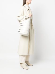 Babel leather shoulder bag Size Info UNI Color Detail White Made In Italy Material leather 100% Season One Spring-Summer Season Two Spring-Summer Product bags.. Brand Alaia Size And Fit Width 9,45 in / 24 cm Height 29,72 in / 75,5 cm Depth 7,87 in / 20 cm Designer Bucket Shoulder Bag For Spring, Designer Spring Bucket Shoulder Bag, Spring Designer Bucket Shoulder Bag, Alaia Bag, Lightweight Bag, Woman Looking, Style Savvy, Crossbody Tote, Knitwear Cardigan