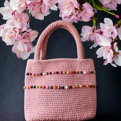 Looking for a stylish and unique accessory to add to your wardrobe? Look no further than my beaded crochet bags with shoulder straps! These bags are the perfect blend of functionality and fashion, with a versatile design that can be dressed up or down to suit any occasion. My beaded crochet bags are handcrafted using high-quality materials, each bag is one-of-a-kind and built to last. The intricate beading adds a touch of glamour to the classic crochet design, making these bags a statement piece Rectangular Beaded Crochet Bag For Daily Use, Everyday Beaded Crochet Tote Bag, Everyday Bohemian Pink Crochet Bag, Everyday Pink Bohemian Crochet Bag, Pink Hand-knitted Crochet Bag For Daily Use, Daily Use Pink Handmade Crochet Bag, Knit Bag, Evening Accessories, Intricate Beading