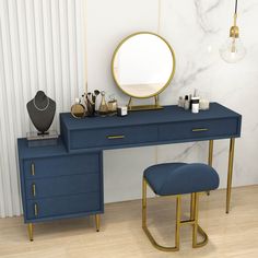 a blue vanity with gold accents and a round mirror on the wall above it, next to a stool