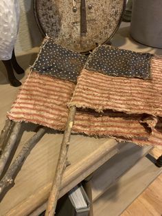 an old american flag is sitting on a table next to a scale and other items