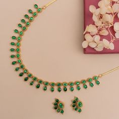 Description: Crafted with a sequence of semi-precious kempu stones, this classic antique gold-plated necklace is a versatile choice, whether for a summer wedding ensemble or a casual get-together. Its demure elegance is a testament to the fusion of exquisite jewelry design and artistic mastery, ensuring it stands out as a head-turner in any setting. Details & Specification: Materials used: Brass Alloy with Antique Gold Plating Weight - Necklace- 28.55 gm, Earrings- 5.8 gm Length - Necklace-11cm, Gold Kundan Necklace With Stones In Temple Jewelry Style, Festive Gold Temple Necklace With Stones, Elegant Gold Temple Necklace With Stone Setting, Kempu Necklace, Antique Green, Choker Pendant, Length Necklace, Kundan Earrings, Kids Necklace