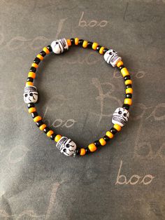 This is a Halloween Skull Bracelet. It would make a spooky addition to a teen's Halloween costume. It would make a great gift for a teen or woman for Halloween. It has orange and black seed beads. It has five skull beads. It was made with .8mm sturdy stretch string. I tie it several times to prevent breakage. It fits most teens and women. It stretches to fit on the wrist. All items are ready to be shipped I do combined shipping. Items ship in 2-5 business days. Check out more items at: http://www.etsy.com/shop/MesheleCrafts https://www.facebook.com/MesheleCrafts Cheap Orange Halloween Bracelets, Handmade Halloween Festival Bracelets, Handmade Halloween Festival Bracelet, Handmade Beaded Bracelets For Halloween, Novelty Beaded Bracelets For Halloween, Halloween Novelty Bracelet With Round Beads, Spooky Adjustable Bracelets For Halloween, Adjustable Beaded Stretch Bracelet For Halloween, Skull Beads