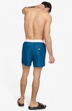 Soak up the sun in these recycled-fiber swim trunks built with quick-drying properties and UPF 40+ sun protection. 5" inseam (size Medium) Elastic/drawstring waist Front slant pockets; back patch pocket Lined 100% REPREVE polyester REPREVE recycled polyester is made from 100% post-consumer recycled plastic bottles Machine wash, tumble dry Imported Soak Up The Sun, Concert Looks, Sports Blazer, Short Suit, Jogger Jeans, Suit Shop, Jogger Sweatpants, Denim Jumpsuit, Casual Streetwear