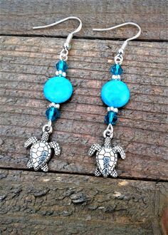 "Sea Turtle Earrings Beach Earrings Blue Jasper Turtle Earrings Sea Turtle Charm Jewelry Nautical Earrings Ocean Sea Life Earrings Handmade Earrings These cute Summer Fun \"Blue Jasper Turtle Earrings\" are a sure to please for the season.  The Tibetan Silver Sea Turtle Charms are adorable, light weight and easy to wear!  If you love the ocean and like wearing Nautical jewelry these earrings are for you.  A must have for all of you Sea Turtle Lovers out there *They are made 10 mm Natural Blue Ja Adjustable Drop Earrings For Vacation, Handmade Adjustable Ocean-inspired Earrings, Dangle Earrings For Beach, Adjustable Dangle Earrings For Vacation, Hypoallergenic Blue Earrings For Summer, Blue Dangle Earrings With Ocean-inspired Style, Ocean-inspired Adjustable Drop Earrings, Ocean-inspired Blue Dangle Earrings, Blue Beaded Dangle Earrings For Beach