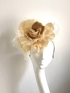 Large gold flower hat This amazing large gold flower hat is made from organza and velvet fabric. The hat sits on the black fabric-covered headband to which I attached small round sinamay base and  a comb so it will sit steadily on your hair. A large gold flower hat will be an amazing accessory to compliment your outfit. It will fit the average head size. You can wear this amazing hat at the wedding, Christening, Horse races, and any other special occasion. Enjoy and please have a look in my shop Gold Costume Hat With Tall Crown For Parties, Gold Fascinator For Royal Ascot And Formal Occasions, Gold Fascinator For Formal Royal Ascot, Gold Mini Hat For Kentucky Derby Party, Gold Curved Brim Costume Hat For Evening, Gold Headpieces For Kentucky Derby Party, Gold Costume Hats For Kentucky Derby Party, Gold Costume Hat With Curved Brim For Evening, Gold Costume Hats With Structured Crown For Evening