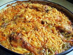 a pan filled with food sitting on top of a table