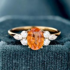 Sunstone Ring, 14k Solid Gold Ring, Orange Sunstone Ring with Moissanite, Engagement Ring, Gift For Her, Natural Sunstone Ring for Women  (in stock) - Metal: 14K Yellow Gold - Custom Color: Rose Gold, Yellow Gold, and White Gold  - Gross weight: 2.33g - Gold Weight: 2.02g - Gemstones: Sunstone, Moissanite - Sunstone CTW: 1.78(1pcs) - Sunstone Size: 5.78*8.04mm - Moissanite CTW: 0.380 (6pcs) - Ring size: 7 - Ring Width: 20.17mm Approximately - Ring Height: 24.09mm Approximate Shipping It usually takes 2-3 weeks to make and 3-5 days to ship We apply a tracking number for every single package. Engraving You can order a custom engraving. (just contact me in advance) Amber Engagement Ring, Sunstone Ring, 7 Ring, Solid Gold Ring, Ring For Women, Moissanite Engagement Ring, Moissanite Engagement, Ring Verlobung, Ring Gift