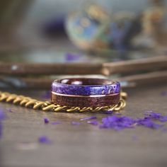 Beautiful and found scattered throughout the British Isles, our bright purple Sea Lavender has a colorful flower and history. Regarded as a symbol of timeless love or many generations, we thought this would be a perfect flower to incorporate into a ring. Sea Lavender has a deeper purple color than our Provence Lavender ring. Features: Antique Walnut Wood from Asheville, NC Dried British Sea Lavender Flowers A center metal inlay of your choosing Everlasting Sea Lavender Known as the “everlasting Lavender Ring, Provence Lavender, Wood Wedding Band, Deep Purple Color, Lavender Roses, Bright Purple, Flower Center, Wood Rings, Lavender Flowers