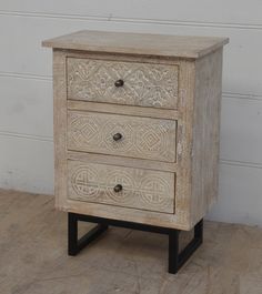 an old wooden cabinet with two drawers