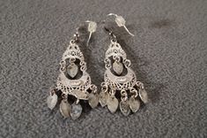 I am offering you these vintage sterling silver gorgeous detailed large and wide ornate filigree scrolled etched euro wire pierced dangle drop earrings. There is endless amounts of open work , heavily etched , raised relief filigree. It is larger than most, measuring app. 2.25 inch, by app. 1 inch , and very layered and dimensional. They weigh app. 4.5 grams. It is a must have for the vintage jewelry collector. Buyer pays all shipping and handling fees, we will always combine shipping. Ornate Engraved Dangle Jewelry, Vintage Sterling Silver Etched Earrings, Vintage Etched Sterling Silver Earrings, Vintage Etched Dangle Earrings, Vintage Etched Dangle Jewelry, Vintage Silver Engraved Earrings, Antique Silver Filigree Earrings, Pierced Earrings, Victorian Style