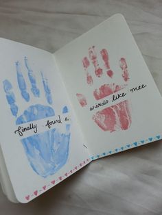 an open book with handprints and writing on the cover that says family finds a world like me