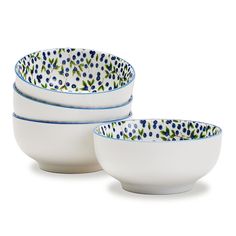 three white bowls with blue and green designs