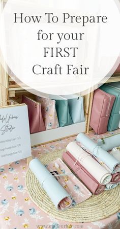 some pink and blue purses are on display in front of a sign that says how to prepare for your first craft fair