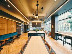 a large room with wooden floors and tables