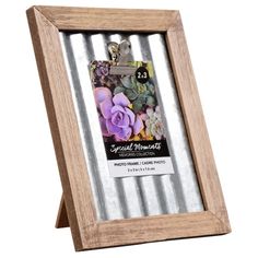 a wooden frame with metal strips and flowers in the front, on a white background