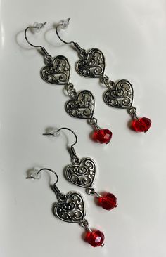 Long Antique Silver Filigree Hearts Dangle Earrings With Crystal Bead And Hypoallergenic Ear Wire - These beautiful, elegant and charming style earrings can give you attention in any gathering Available in 2 sizes: 1- Double Rose - (2.5 inches long) 2- Single Rose - (1.75 inches long) Metal Heart Beaded Earrings For Gifts, Metal Heart Beads Earrings For Gifts, Heart Beads Metal Earrings For Gift, Gift Metal Heart Earrings With Heart Beads, Metal Dangle Heart Earrings With Heart Beads, Metal Heart Dangle Earrings With Heart Beads, Dangle Heart Bead Earrings, Elegant Metal Earrings With Heart Beads, Dangle Heart Earrings With Heart Beads