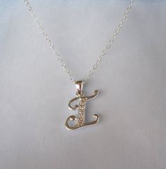 925 sterling silver Monogram INITIAL LETTER I with cz stones personalized charm with chain necklace.Pendant and chain - 925 sterling silver (hallmarked). Please choose the length of the chain from the menu.The pendant (without the bail) is 14mm x 12mm (0.55" x 0.47").The necklace comes bubble wrapped and gift wrapped in a complementary organza bag. Sterling Silver Hallmarked Initial Pendant Necklace, Hallmarked Sterling Silver Initial Pendant Necklace, Silver Hallmarked Initial Pendant Name Necklace, Sterling Silver Initial Necklace With Name, Silver Cubic Zirconia Initial Pendant Necklace, Cubic Zirconia Initial Pendant Charm Necklace For Anniversary, Silver Initial Pendant Name Necklace For Anniversary, Anniversary Initial Pendant Charm Necklace In Cubic Zirconia, Personalized Silver Initial Pendant Necklace