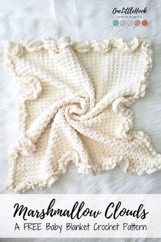 a crocheted baby blanket with the words marshmallow clouds written on it