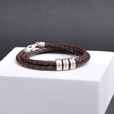 The Ultimate Men's Gift for Your Special Someone!  - "Ideal gift for the Holidays" Expertly handcrafted, this unique bracelet combines genuine leather with customizable 925 silver beads, offering a distinctive and considerate present for your partner, a friend, or a family member.  It's an excellent choice for various occasions including birthdays, anniversaries, Christmas, Valentine's Day, Father's Day, and more. ★ ITEM DETAILS: * Materials: Genuine Leather   *  925 Sterling Silver Charms and C Adjustable Name Bracelet With Engraving Option For Anniversary, Engraved Name Bracelet For Anniversary Gift, Adjustable Jewelry For Father's Day Personalized Gift, Personalized Bracelets For Birthday Gift On Father's Day, Classic Name Bracelet For Father's Day Gift, Adjustable Name Bracelet For Valentine's Day Anniversary, Classic Bracelets For Anniversary And Mother's Day, Adjustable Engraved Name Bracelet For Anniversary, Adjustable Engraved Name Bracelet For Anniversary Gift