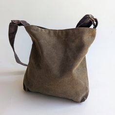 The Khaki canvas Mini May is a small size handbag, hobo bag with a chic sack like style. It can be made from a large variety of shades and fabrics. ** USAGE ** This bag is perfect for an evening out or an easy day. Fun for the young in age or spirit... ** SPECIFICATIONS ** Features: + 1 internal side pocket which closes with a Velcro snap. + Closes with a magnetic snap. Approximate Dimensions: 11" height 11" width 2" deep Strap: Short - 19" (48 cm) Crossbody - 46" (117 cm) Weight: ~200 grams ** Canvas Crossbody Bucket Bag For On-the-go, Khaki Canvas Bag For On-the-go, Large Capacity Canvas Hobo Satchel Bag, Canvas Bucket Bag With Large Capacity, Brown Bucket Bag With Canvas Lining For Daily Use, Khaki Canvas Shoulder Bag With Canvas Lining, Khaki Canvas Shoulder Bag For Everyday Use, Khaki Shoulder Bag With Canvas Lining, Rectangular Khaki Canvas Bag For Everyday