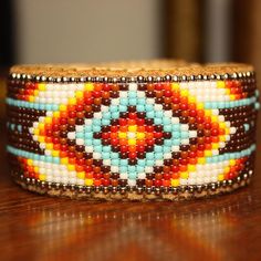 a close up of a beaded bracelet on a table