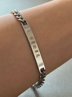 This listing is for a personalized engraved Chinese name large bar bracelet in stainless steel. Stainless steel jewelry is strong and almost never tarnish or corrode. The sample bracelet is engraved with the name Bruce Wayne in Chinese in the font #4 and the date is engraved in the font #13 on the back of the bar. Please check the font options in the pictures: the font #3,4 & 5 is only written in traditional Chinese and #6 is only written in simplified Chinese. #1 and 2 is available for both tra Engraved Adjustable Stainless Steel Chain Bracelet, Adjustable Engraved Stainless Steel Chain Bracelet, Engraved Rectangular Stainless Steel Bracelets, Rectangular Engraved Stainless Steel Bracelets, Silver Stainless Steel Bracelet With Engraved Text, Silver Stainless Steel Name Bracelet For Friendship, Rectangular Stainless Steel Engraved Bracelets, Customizable Silver Stainless Steel Name Bracelet, Silver Stainless Steel Name Bracelet With Engraved Text