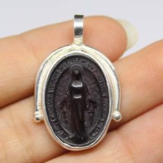 -Description: Intaglio Glass, Virgin Mary Pendant, glass art Intaglio Gift, 925K Sterling Silver, Intaglio Ancient Roman Art, Sterling SilverMen's Women's Handmade Pendant by Artintaglio Fine Jewelry - Intaglio Glass,  - Virgin Mary Pendant - Sterling Silver 925 K - Replica Bronze Coin  - Available Finish Color: Rose Gold, Yellow Gold, Silver - Gemstone : Bronze Replica Intaglio Coin - Listing Just for one piece ring - Ready to Ship in 2-5 Business Days This would make a lovely promise or engagement Pendant. Hand Made Natural Designer Each one Sapphire Emerald And Ruby Sterling Silver 925K,Ring Sterling Silver 925 K  Genuine Ring Jewelry Gemstone   My work is my reputation, you will be happy with the quality ,all my work is 100% genuine and comes with a special guarantee for all my custome Ancient Roman Art, Virgin Mary Pendant, Roman Art, Glass Ring, Glass Rings, Glass Gifts, Keep Jewelry, Handmade Pendant, Handmade Pendants