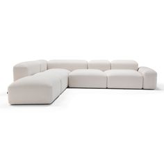 a large white couch sitting on top of a white floor