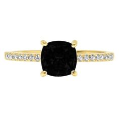 a black diamond ring with diamonds on the band and an oval cut stone in the center