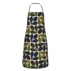 an apron with green, blue and black leaves on the front is hanging from a metal hook