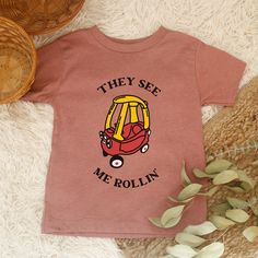 "This listing is for a \"\"They See me Rollin' \" Funny Cozy Coupe toddler shirt. This is an original design cute funny Toddler shirt. Perfect for your little one or makes a great gift for toddlers. This Funny Car Kid Shirt is part of my \"Kid+Toddler+Baby Shirts\" Collection. This Toddler Car shirt is made especially for you as soon as you place an order, which is why it takes us a bit longer to deliver it to you. Making products on demand instead of in bulk helps reduce overproduction, so than Toddler Boy Shirts, Digital Art Software, Toddler Graphic Tee, Funny Toddler Shirt, Funny Toddler, Toddler Car, They See Me Rollin, Clothes Trendy, Toddler Humor