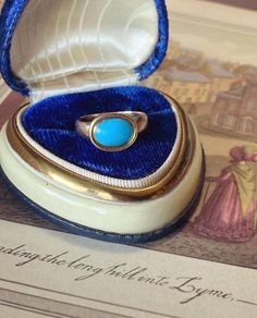 If you are a Jane Austen lover (like me!) or a lover of all things Georgian (also, like me!) then you are sure to swoon over this 'robin egg blue' Persian turquoise solitaire ring that is incredibly similar to Jane Austen's ring housed in Chawton UK, and which was, indeed, made in the same period as hers! Dating from the mid-1770s--the start of the Neoclassical aesthetic in Georgian era design of the 18th century--this ring may be understated in structure but the bright blue of the turquoise packs a striking visual effect.  Jane Austen's ring--pictured as the last picture in this listing for comparison--has become iconic for all Austen devotees and replicas abound.  As a collector myself, this is the only authentic 18th century Georgian ring I have encountered on the public market that res Classic Turquoise Ring For Formal Occasions, Classic Formal Turquoise Ring, Antique Oval Turquoise Ring Hallmarked, Vintage Turquoise Promise Ring, Turquoise Vintage Promise Ring, Antique Hallmarked Turquoise Ring, Antique Turquoise Gemstone Ring For Formal Occasions, Antique Turquoise Anniversary Ring, Heirloom Style Hallmarked Turquoise Ring For Formal Occasions