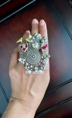 Festive dual tone Ethnic Afghani Adjustable Finger Ring studded with Pachi Kundan ghunghroo with cluster pearls. Beautiful lotus and bird motifs. Jumbo festive adjustable ring. Oxidized Fusion Ring. ✅Shop our collection here: https://www.etsy.com/shop/KKsCulture We want you to LOVE your new jewelry!  CARE TIP  1. Keep away from moisture and perfume 2. Store in cotton or zip lock bags or air tight boxes. 3. Spot cleaning only. 4. Jewellery is the last thing you should wear and the first thing you Rings Indian, Fusion Ring, Trendy Jewellery, Oxidized Ring, Bird Motif, Jewelry Statement, Finger Ring, Ring Finger, Trendy Jewelry