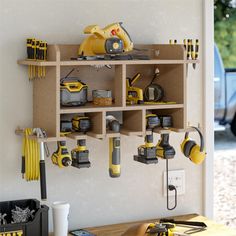 a workbench with tools hanging from it's wall and on the shelf