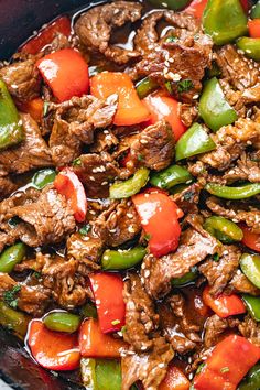 beef and peppers stir fry in a skillet