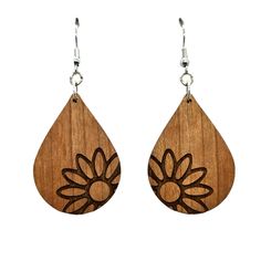 Wood earrings in a teardrop shape engraved with one Big Floral Daisy on the edge handcrafted in the USA in a small father and daughter wood shop in Northern California.Nickel Free Wire HooksFinished Wood on Both Sides1.5" x 1" x .125" thickThis is not the exact pair of dangle hook earrings that will be shipped. Wood grain and coloring will vary with each piece. Backs may have some black burn/kind of pock marks. Please see pictures for a couple of examples.Here at Happy Wood Products, we also offer wholesale and bulk discounts. Please feel free to follow us on social media for new releases, sales announcements, and more.0524 Big Daisy, Wood Dangle Earrings, Big Floral, Father And Daughter, Wood Products, Wood Earrings, On The Edge, Wood Shop, Hook Earrings