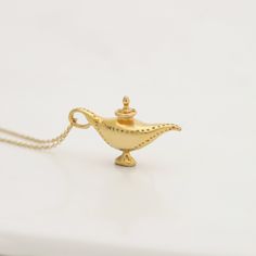 Handmade Silver Yellow Gold Plated Oil Lamp. Alladin's Oil Lamp from my Fairytale collection It can be a perfect Birthday Gift with a Personal Engraving.   Oil lamp necklace made with the 'lost wax' technique. Sweet, shiny and adorable, you would want to wear it everyday and keep the sea adventures alive.  🎁 Gift packacking and FREE delivery worldwide is included in every order submitted to my shop: Material ► Solid Sterling Silver Oil Lamp & Chain, ( 925 hallmarked stamp) ► Yellow Gold plating Lamp Necklace, Fairytale Lover, Magical Lamp, Genie Lamp, Aladdin Lamp, Lamp Pendant, Jewelry Workshop, Disney Jewelry, Oil Lamp