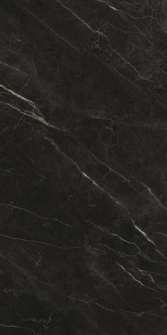 a black marble textured surface with white lines