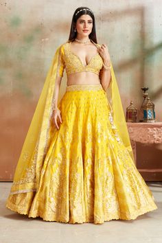 Shop yellow embroidered Banarasi silk lehenga online in USA with dupatta. Look your best on festive occasions in latest designer saris, pure silk sarees, Kanjivaram silk sarees, handwoven saris, tussar silk sarees, embroidered saris from Pure Elegance Indian clothing store in USA.-full view Yellow Raw Silk Sets For Wedding, Yellow Raw Silk Wedding Sets, Yellow Dola Silk Sets For Reception, Yellow Art Silk Set For Reception, Yellow Raw Silk Choli With Intricate Embroidery, Reception Yellow Sharara With Intricate Embroidery, Yellow Dola Silk Anarkali Set With Intricate Embroidery, Yellow Dola Silk Lehenga For Festivals, Yellow Anarkali Set With Intricate Embroidery In Dola Silk