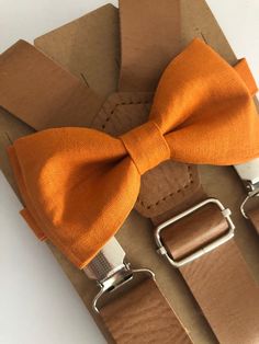 Vintage Tan leather suspenders and bow tie set.Size adult suspenders are 55" long.  Bow tie measures 5x 2 3/4", neck strap is 24" long.Please allow me 2-3 days to make your ties as I don't always have them ready to ship.If you have any questions, please message me.WEDDING ORDERS: Please let me know your wedding date to assure I can meet your deadlines. It take about 5 days to make wedding orders. INTERNATIONAL ORDERS: Please review shipping policies as first class shipping can take up to 2-4 wee Fitted Belts And Suspenders With Bow For Party, Classic Bow Tie With Suspenders For Party, Dapper Suspenders For Party, Classic Party Bow Tie With Suspenders, Classic Adjustable Belts And Suspenders For Party, Classic Adjustable Belts And Suspenders For Summer, Dapper Party Suspenders, Classic Party Belts And Suspenders With Bow, Dapper Adjustable Belts And Suspenders With Ties