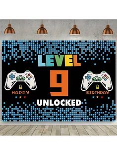 an image of a video game birthday banner with the number 9 and two controllers on it