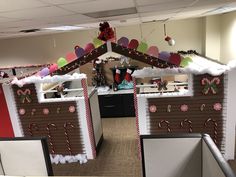 an office decorated for christmas with candy canes