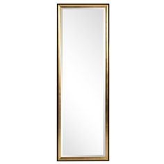 a tall mirror sitting on top of a white wall