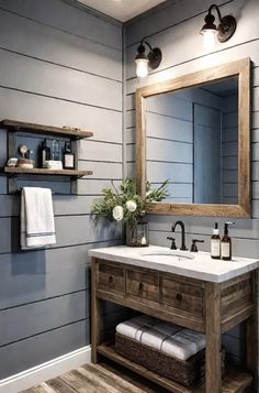 a bathroom with gray walls and wood accents, including a wooden sink vanity topped with a white marble countertop