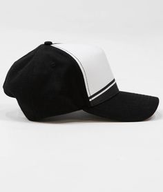 a black and white baseball cap on a white background